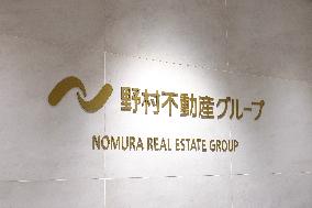 Nomura Real Estate signboard and logo